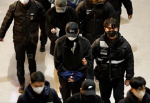 变脸整形逃避抓捕 柬埔寨遣返73名韩国诈骗犯