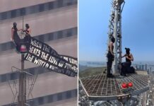 攀爬帝国大厦443米塔尖秀“世界和平”并当场求婚 俄极限艺术家被捕